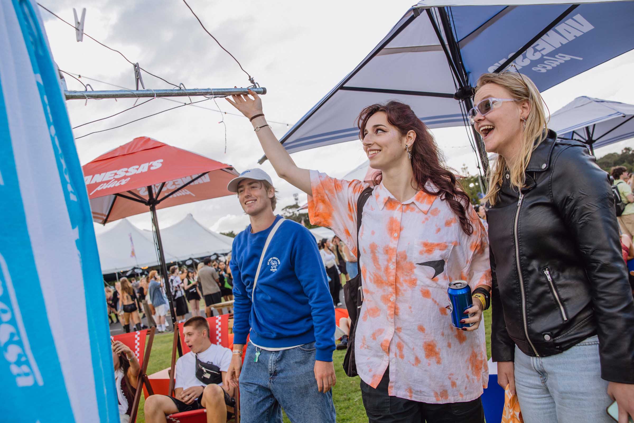 Three young people smiling